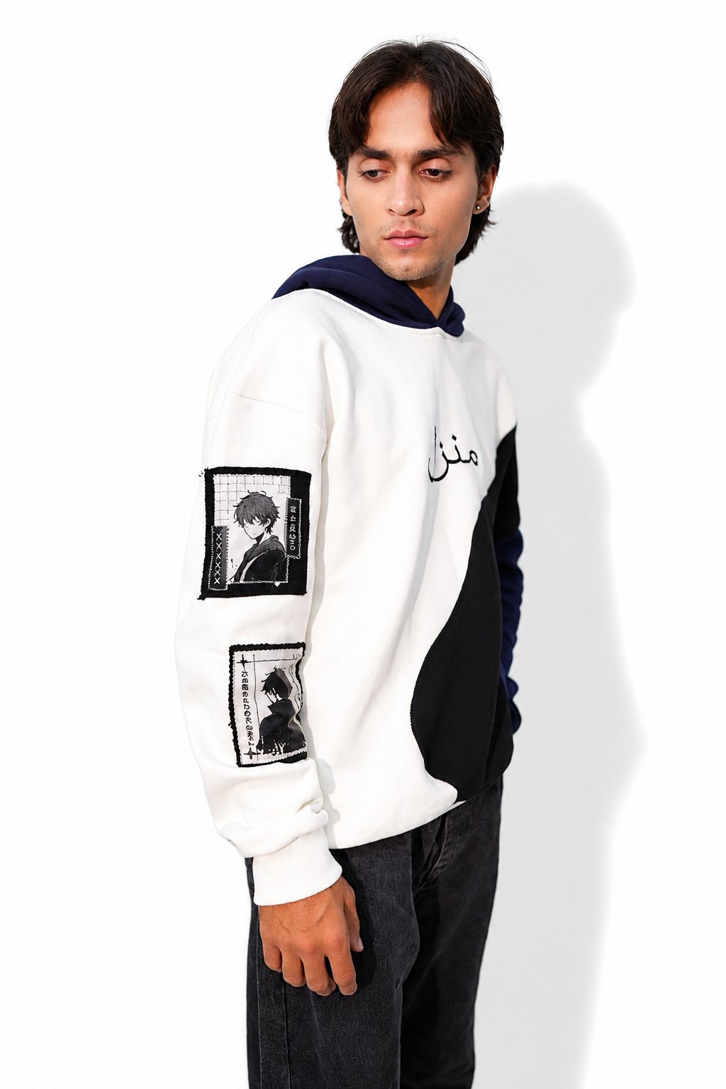 Side view of the Manzil navy and white hoodie showing the printed sleeve patches